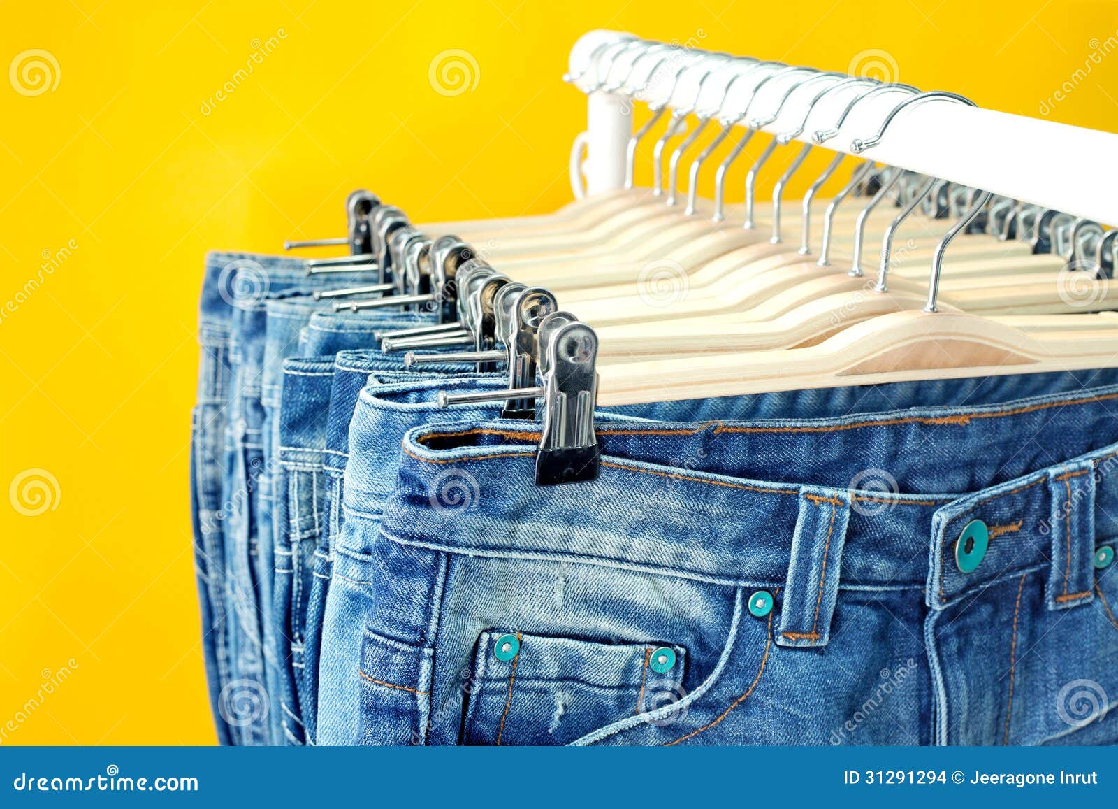 Row of hanged blue jeans stock photo. Image of business - 31291294