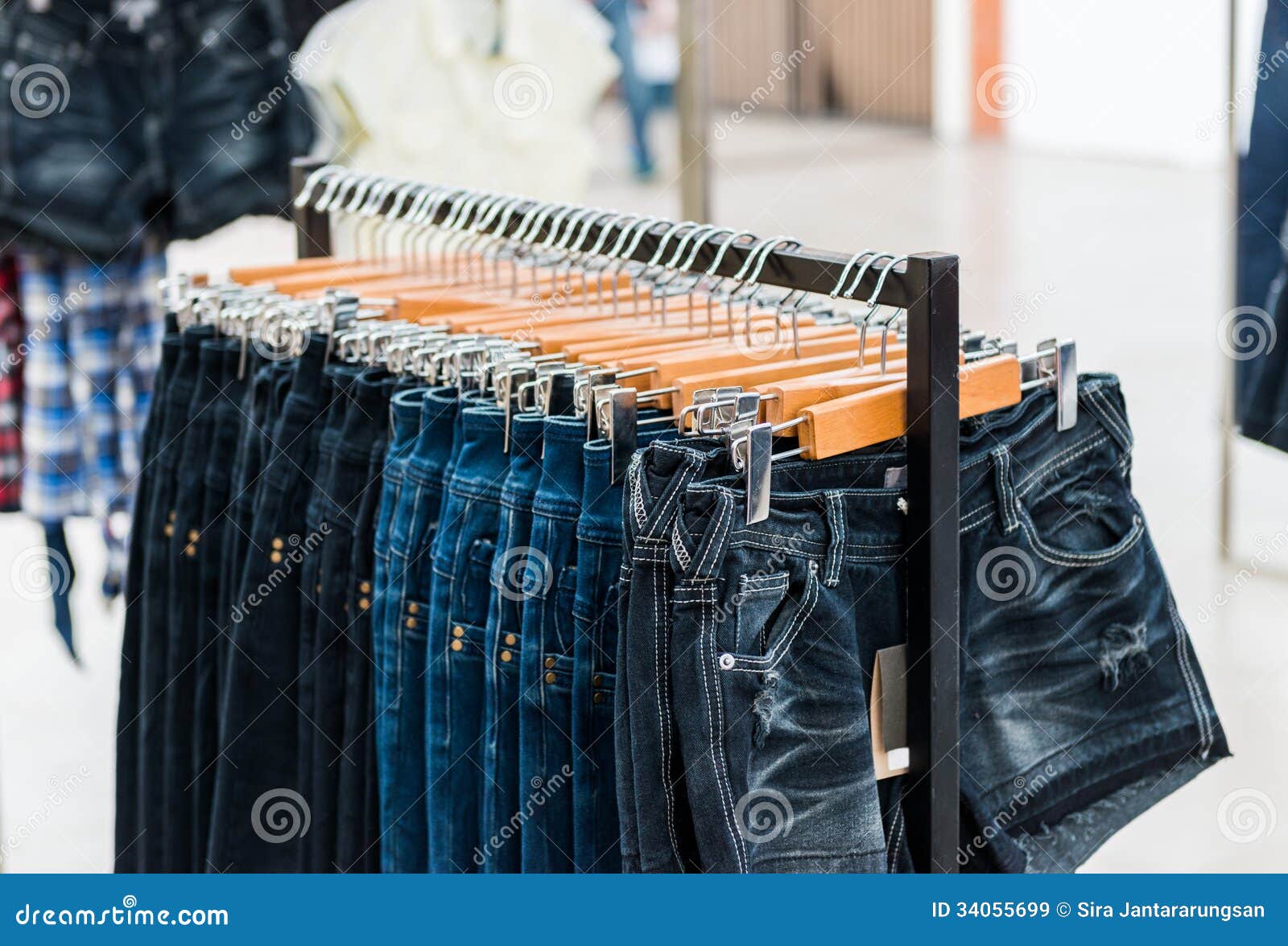 Row of hanged blue jeans stock image. Image of bluejeans - 34055699