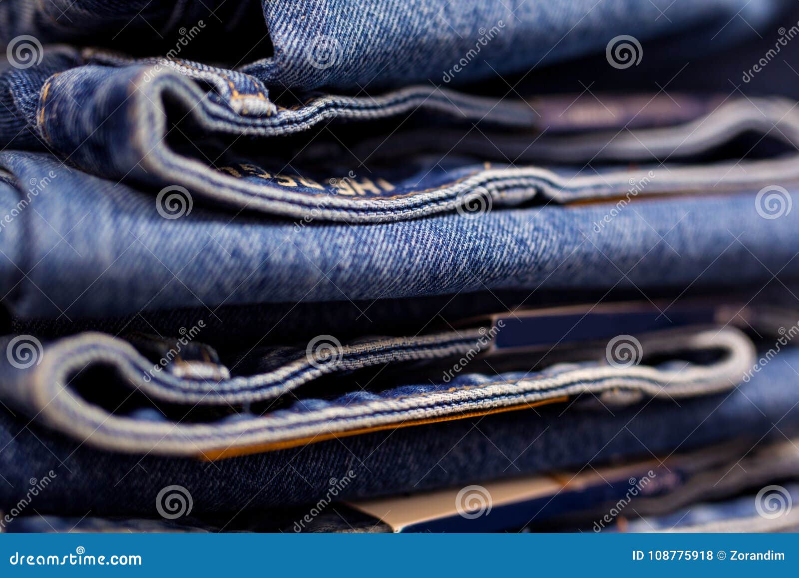 Row of Hanged Blue Jeans in a Shop Stock Photo - Image of pattern ...