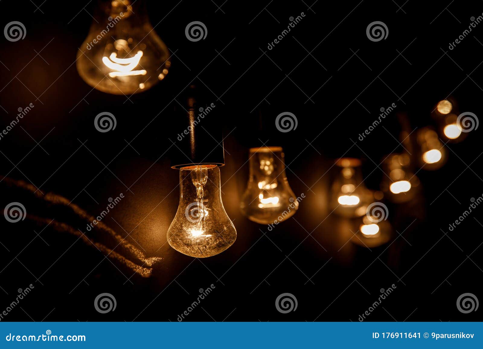 a row of light bulbs. focus on the closest