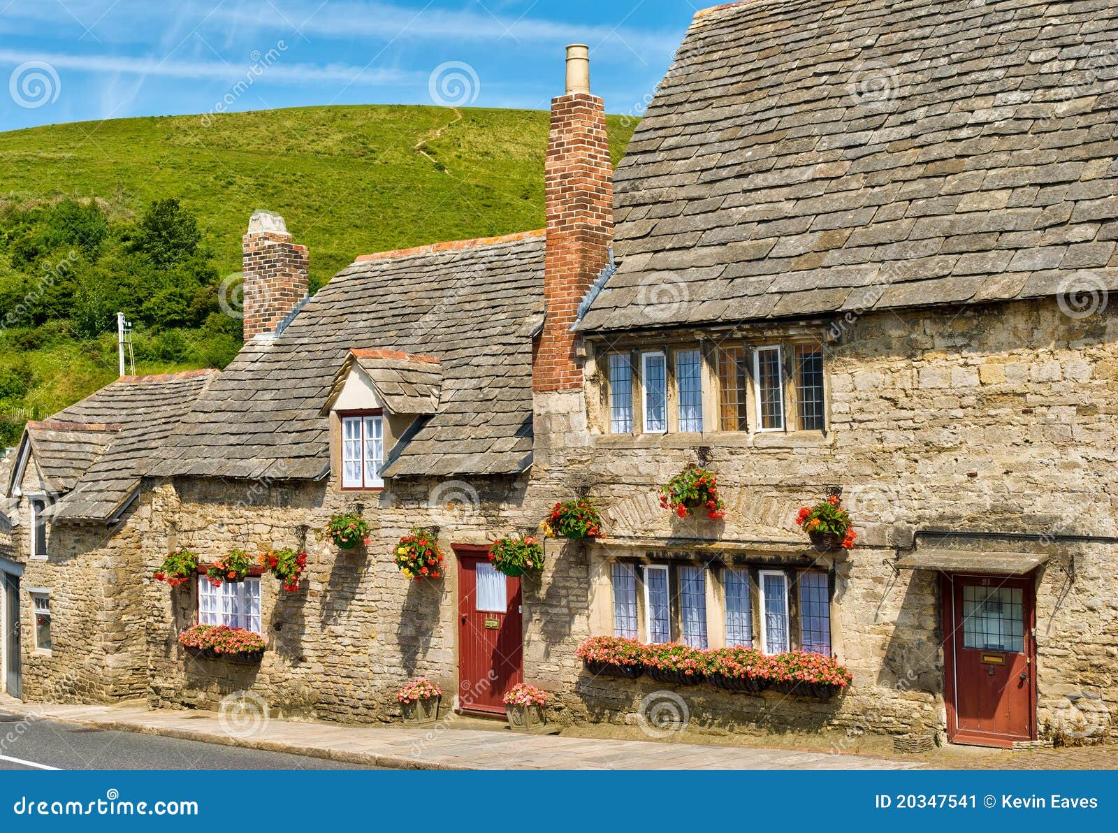 row of limestone cottages in an english village