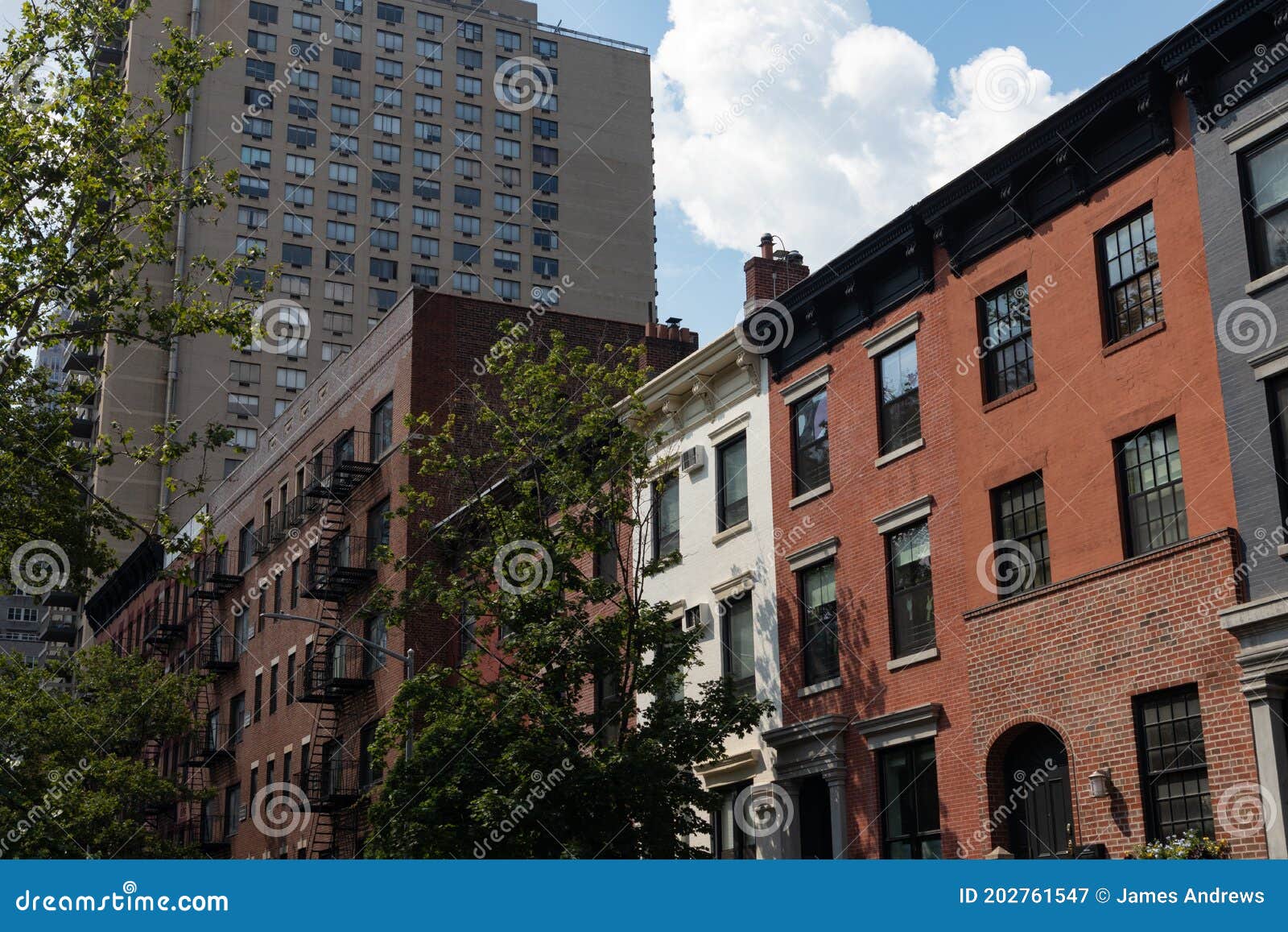 row of old brick residential buildings in kips bay of new york city