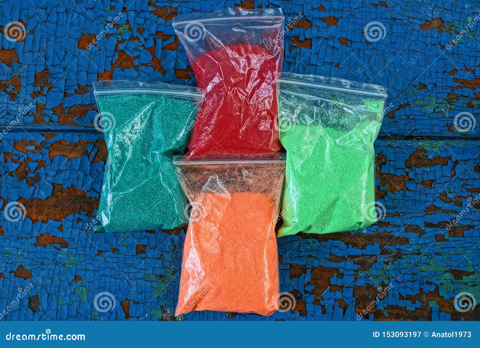 Plastic Bags with Colored Sand on a Blue Table Stock Image Image of