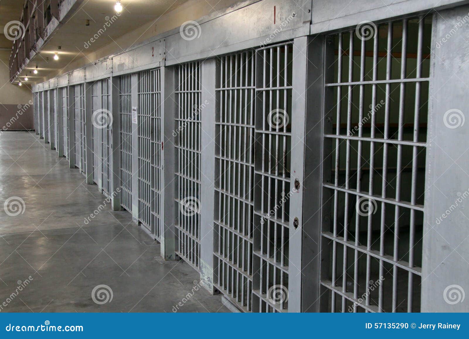 row of prison cells in a cell block
