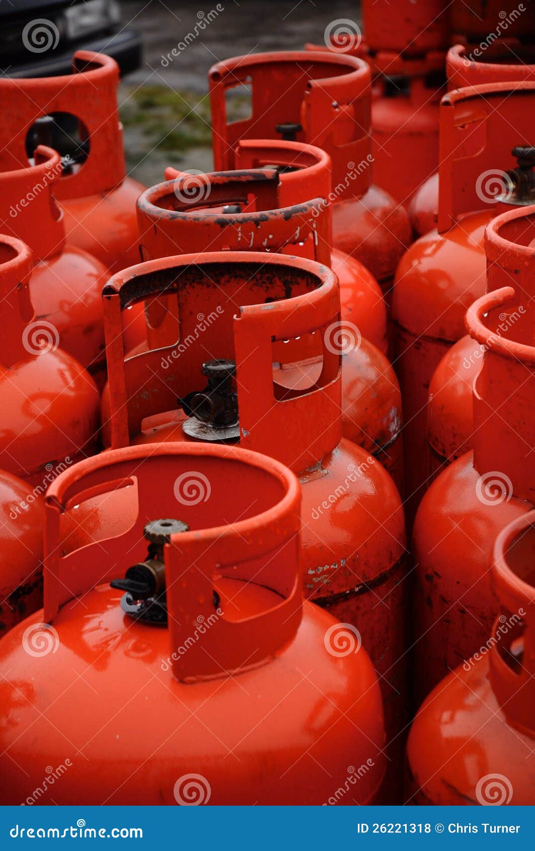 Row of red gas canisters stock photo. Image of canned 26221318