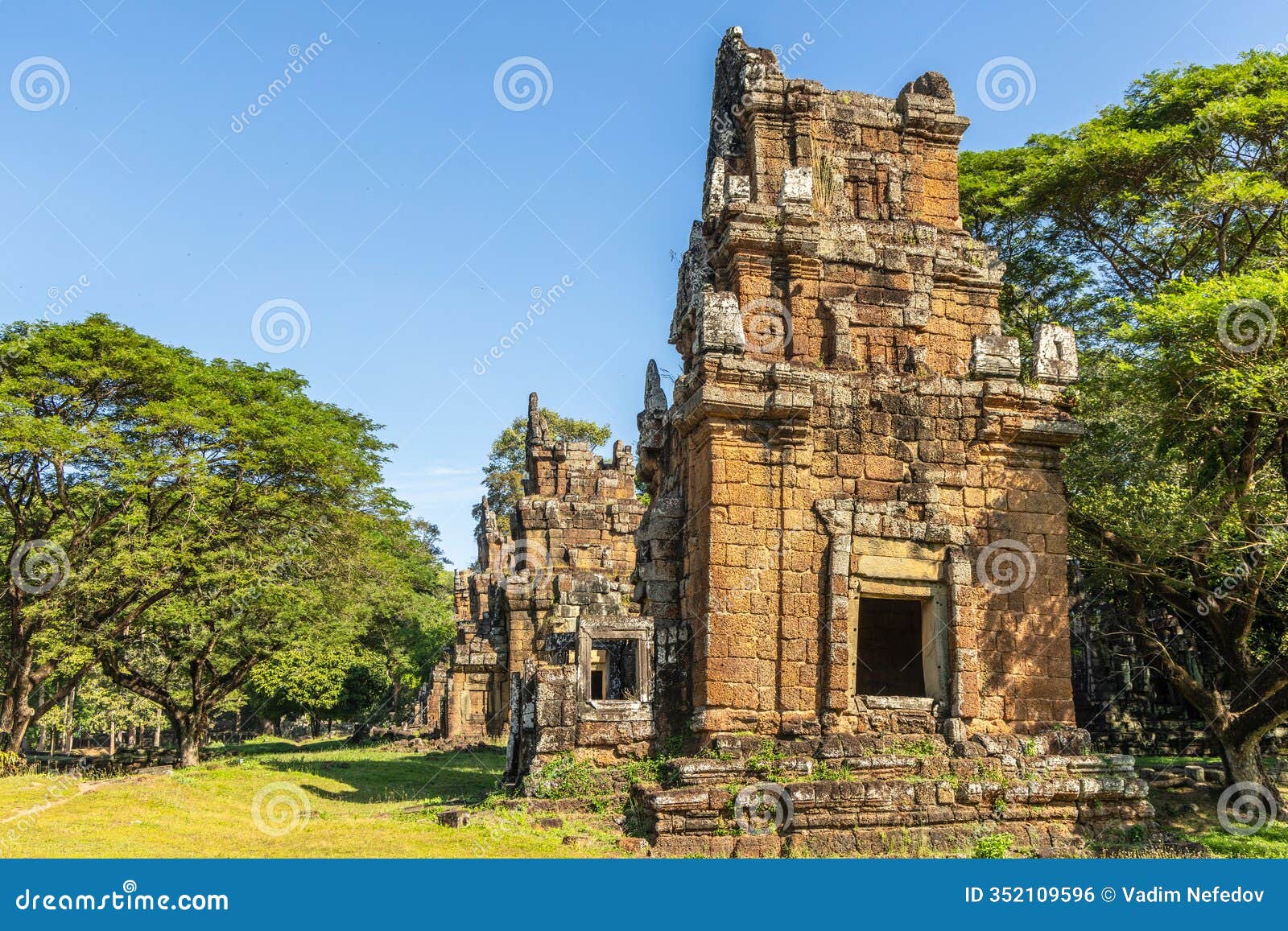 row of ruined towers of ancient prasat suor prat temple standing in the jungles,, angkor thom archaeological park, siem reap,