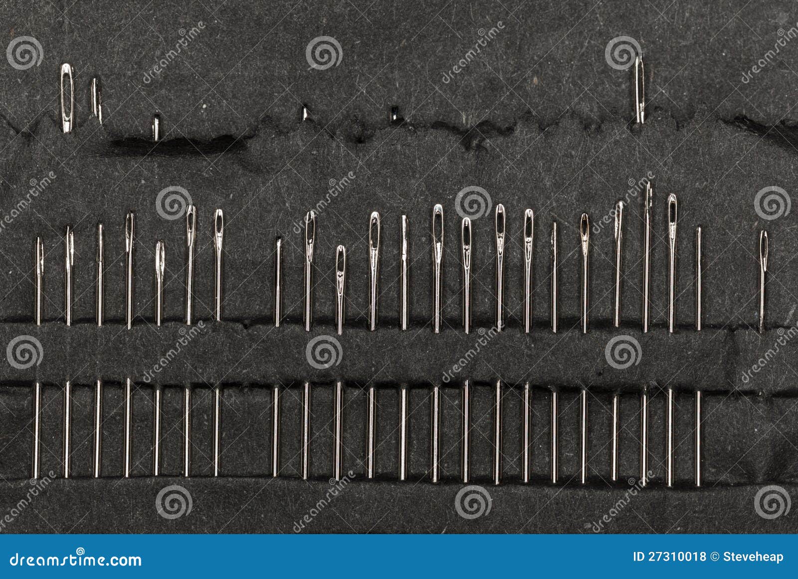 row of sewing needles in case