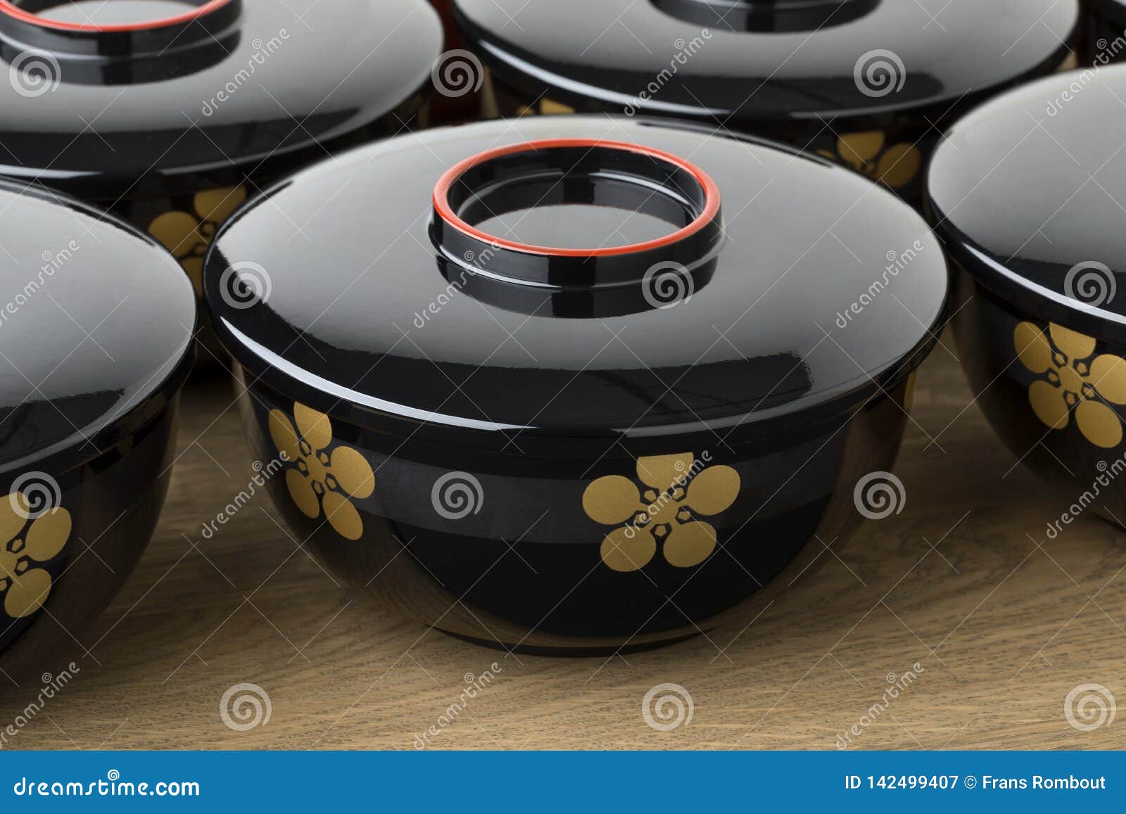 row of traditional black lacquered japanese bowls