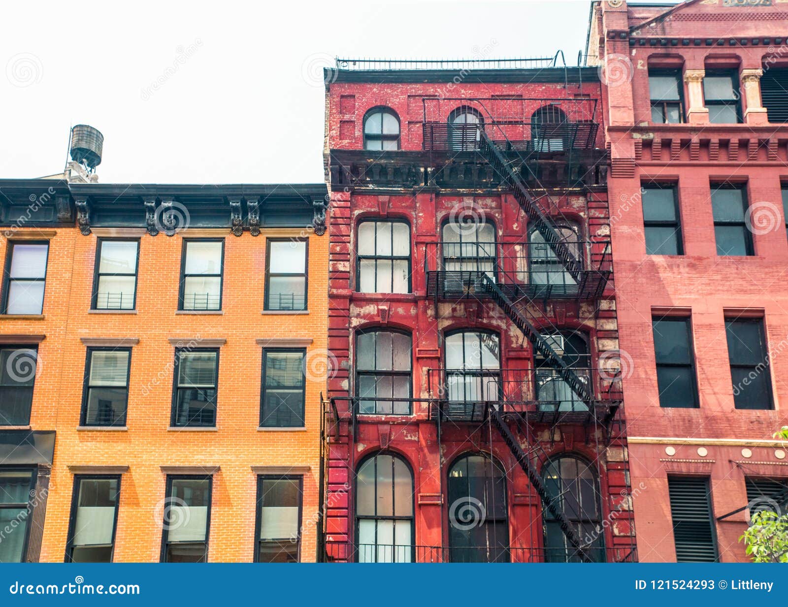 row of vintage new york city apartment building facades