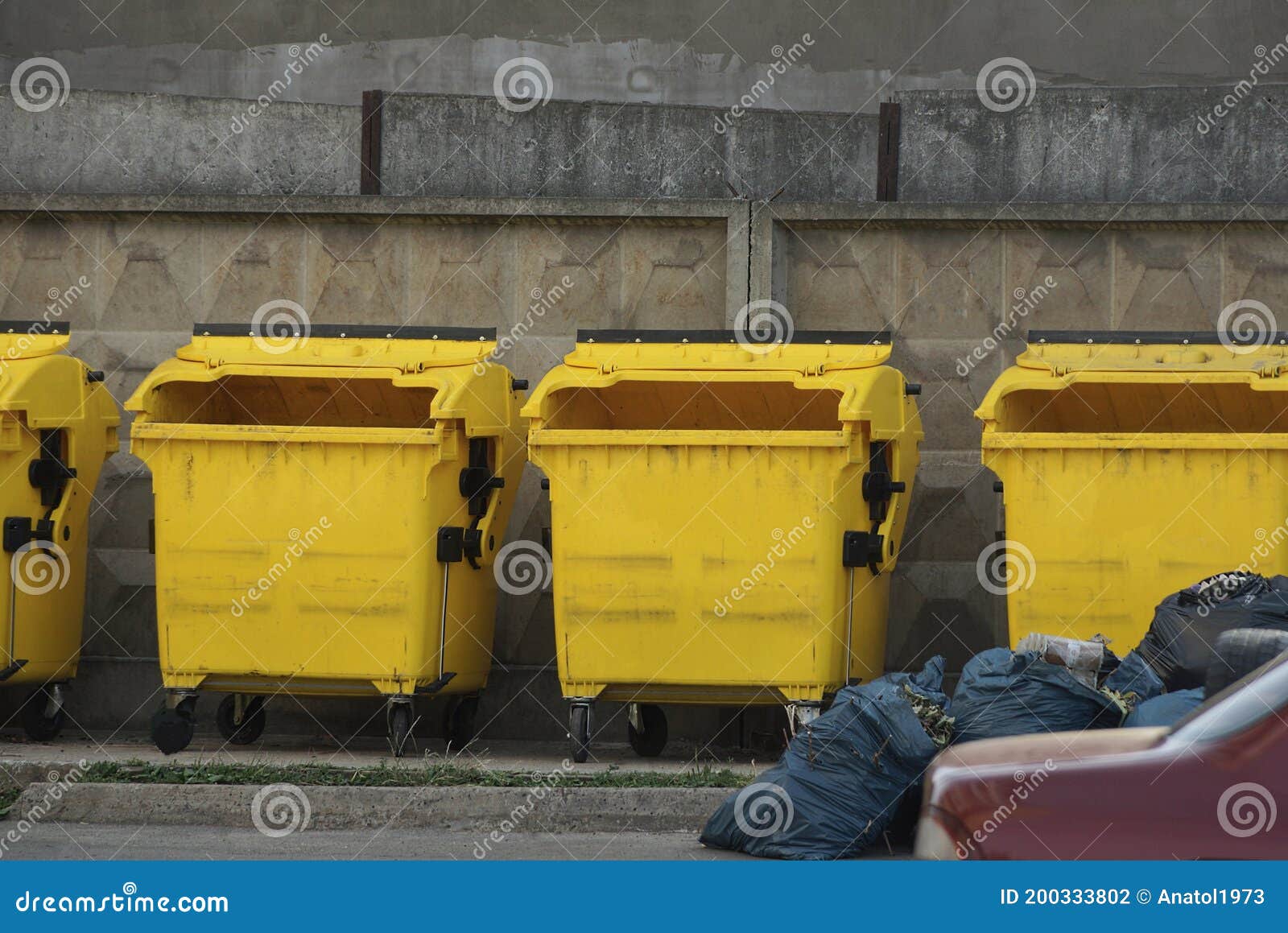 A Row of Yellow Plastic Dumpsters Stock Photo Image of plastic