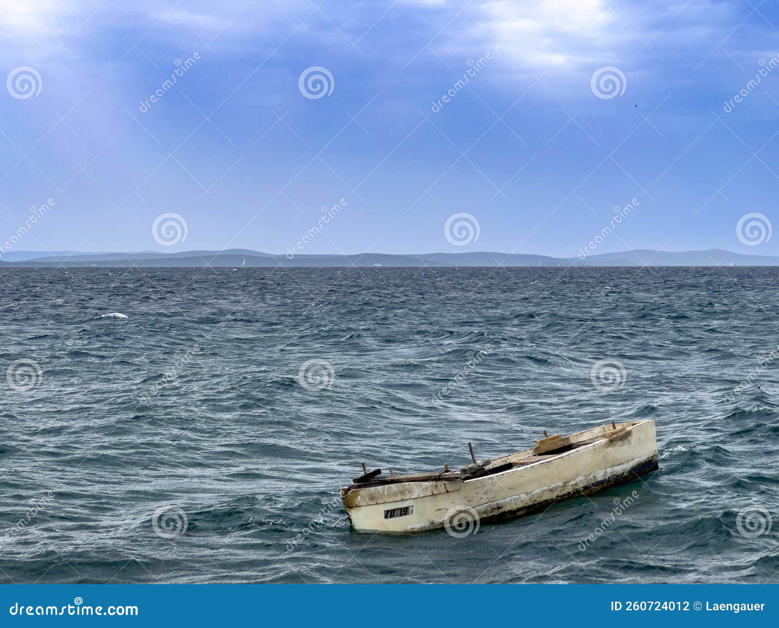 Rowing Boat Anchoring in the Rough Tide of the Side Rowing Boat