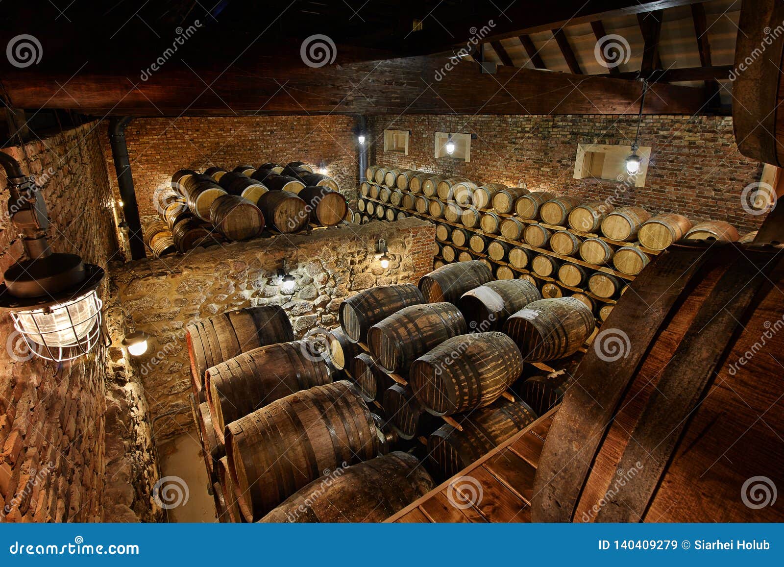 rows of alcoholic drums in stock. distillery. cognac, whiskey, wine, brandy. alcohol in barrels