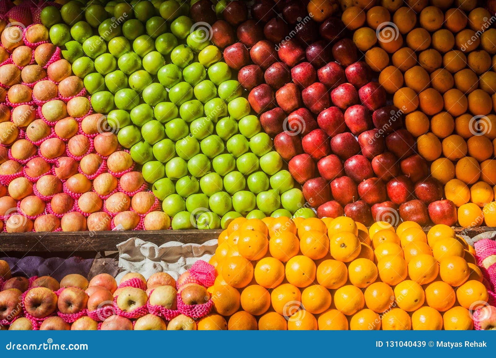 Rows of Apples and Oranges at a Market in Colombo, Sri Lan Stock Image