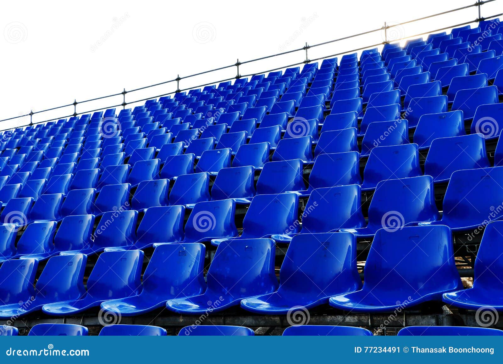 rows of blue seats temporary stadium