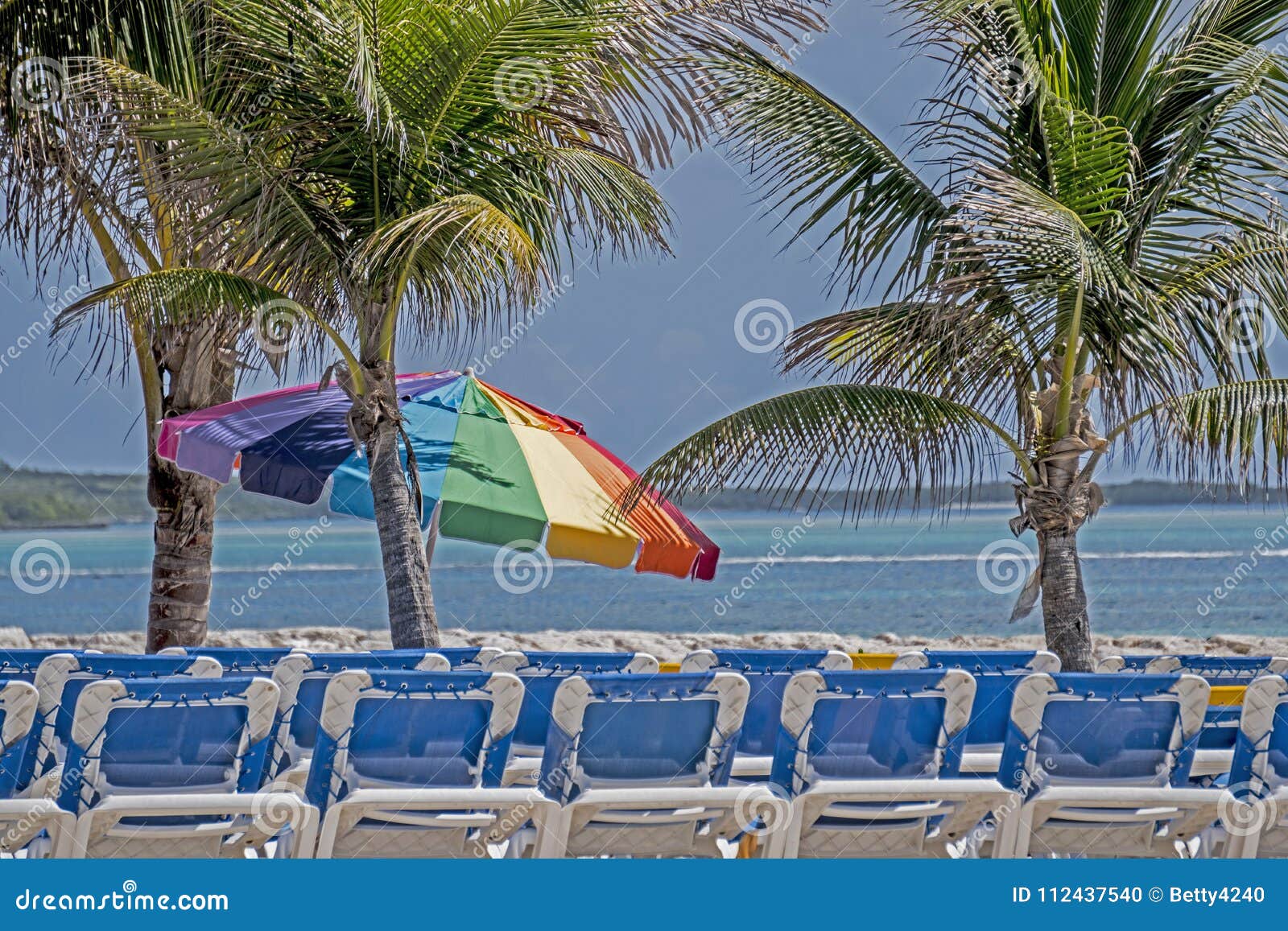 Rows of Chairs and Beach Umbrellas in the Bahamas. Stock Photo Image of beach, lagoon 112437540