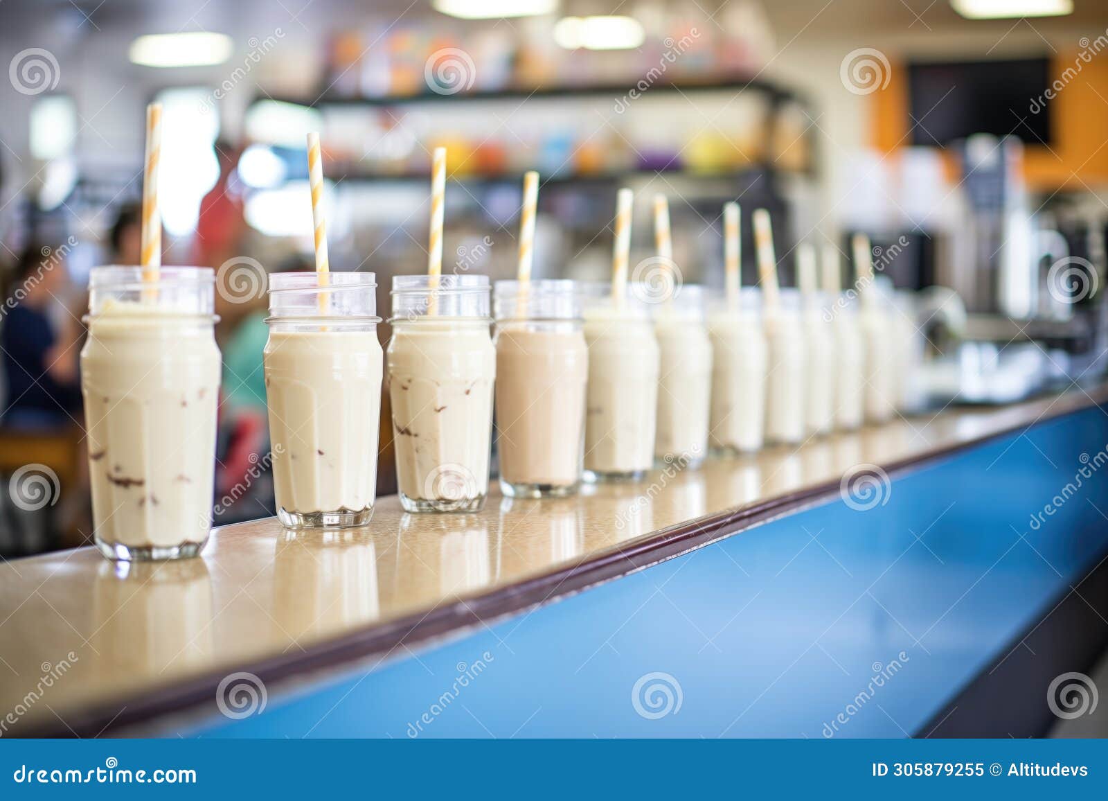 rows of coffee shakes ready for service in a caf