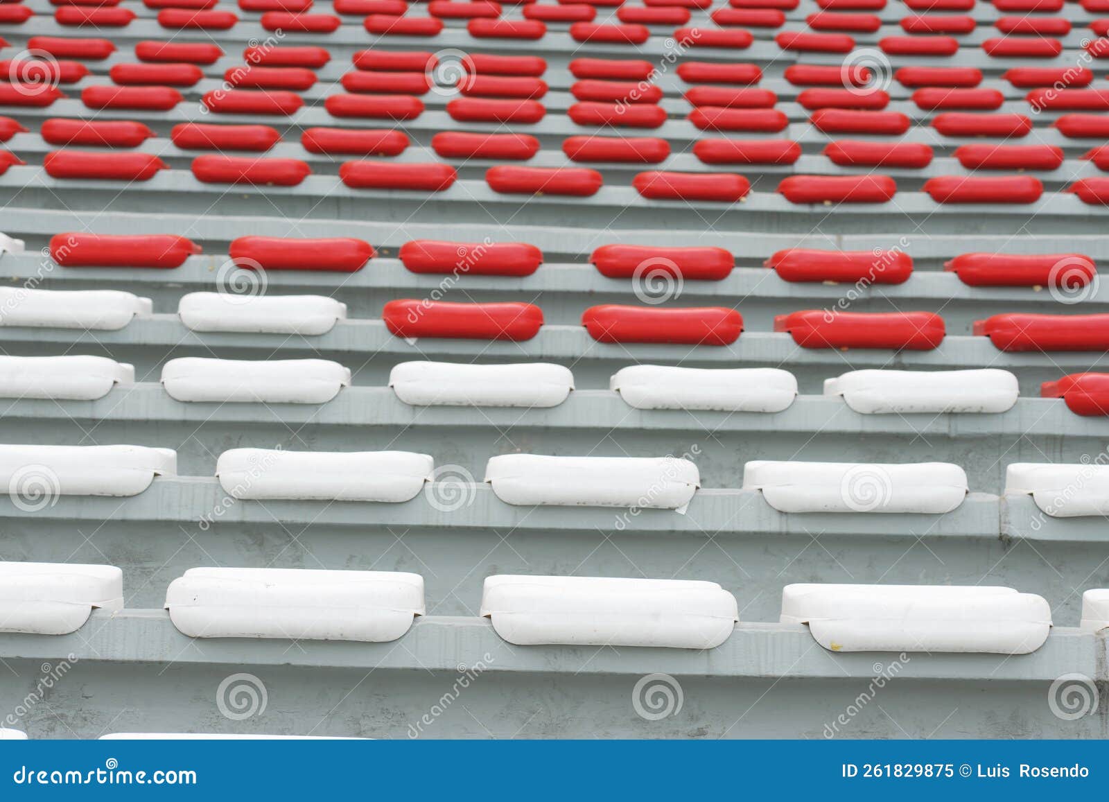 rows of empty orange and white seats in the sports complex of the estadio nacional - soccer stadium - in lima peru