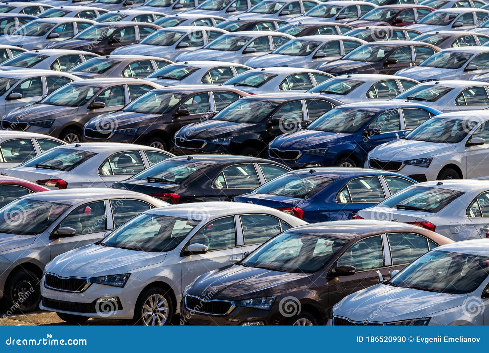 Rows Of A New Cars Parked In A Distribution Center On A Car Factory On