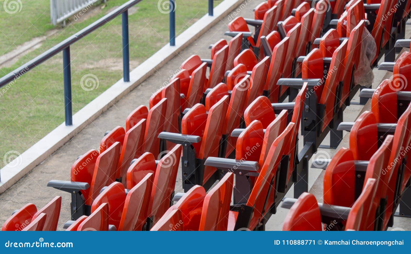 The Rows of Red Folding Chairs in the Football Stadium Stock Image