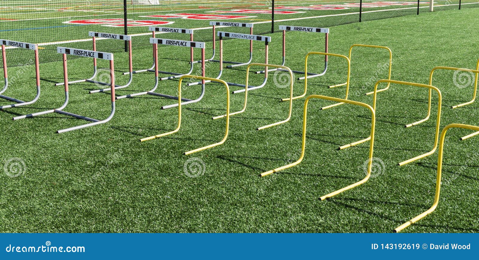 rows of regular and plastic hurdles set up on field