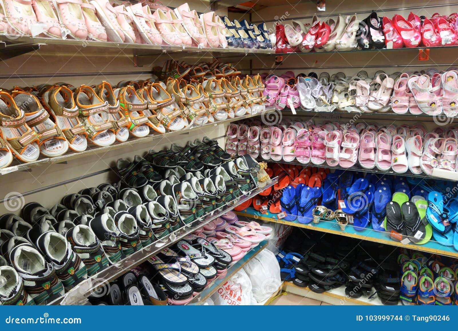 Rows of Stylish Children Shoes on a Rack Editorial Stock Image - Image ...