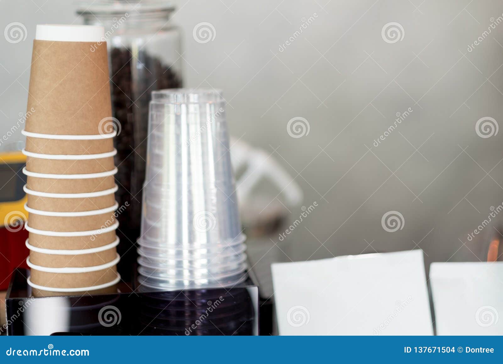 Rows of Upside Down Transparent Plastic Cup and Brown Cardboard Cups