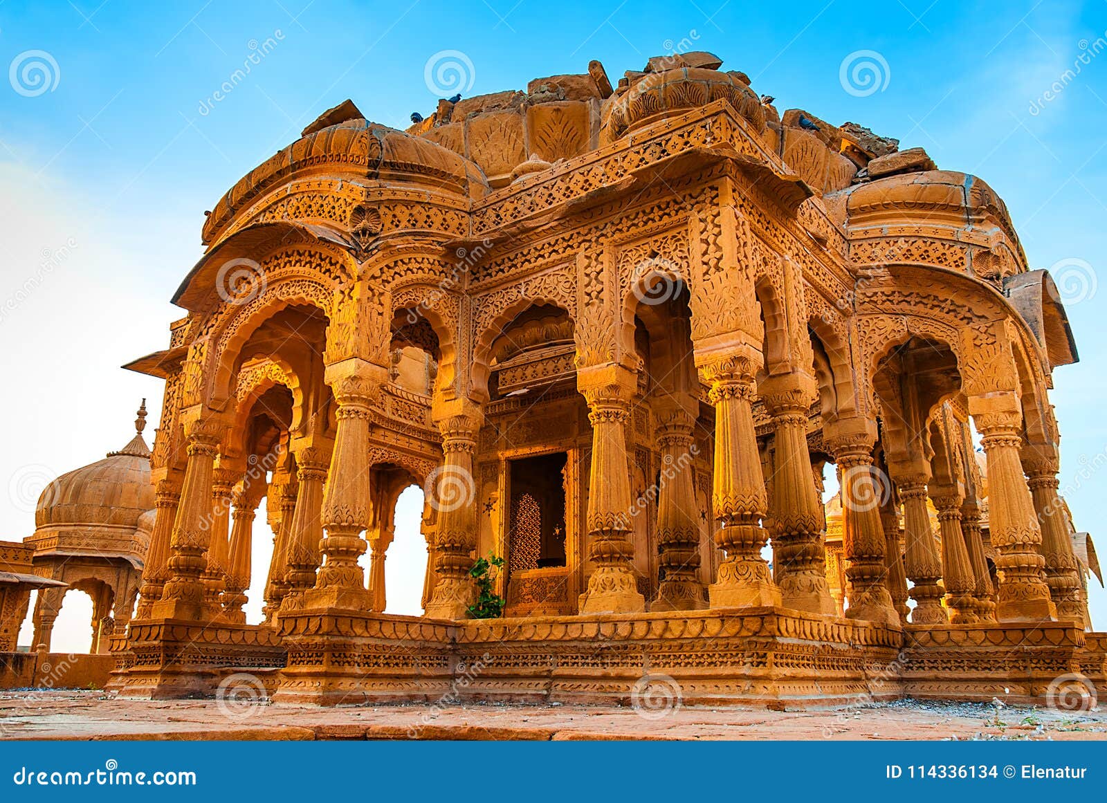 bada bagh in jaisalmer, rajasthan, india. cenotaphs made of yellow sandstone at sunset