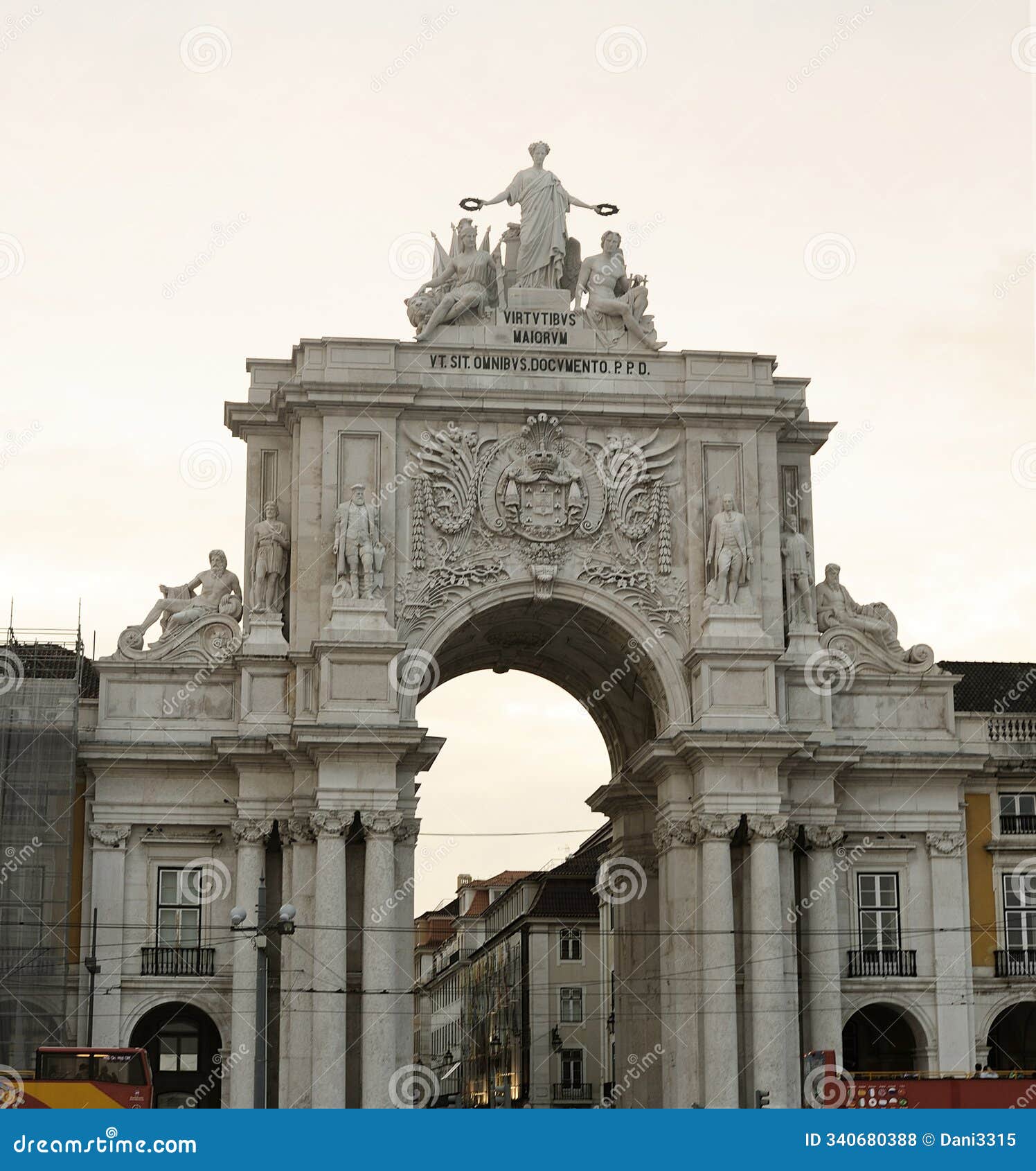 rua augusta arch monument in lisbon, portugal, captured from low angle under cloudy sky