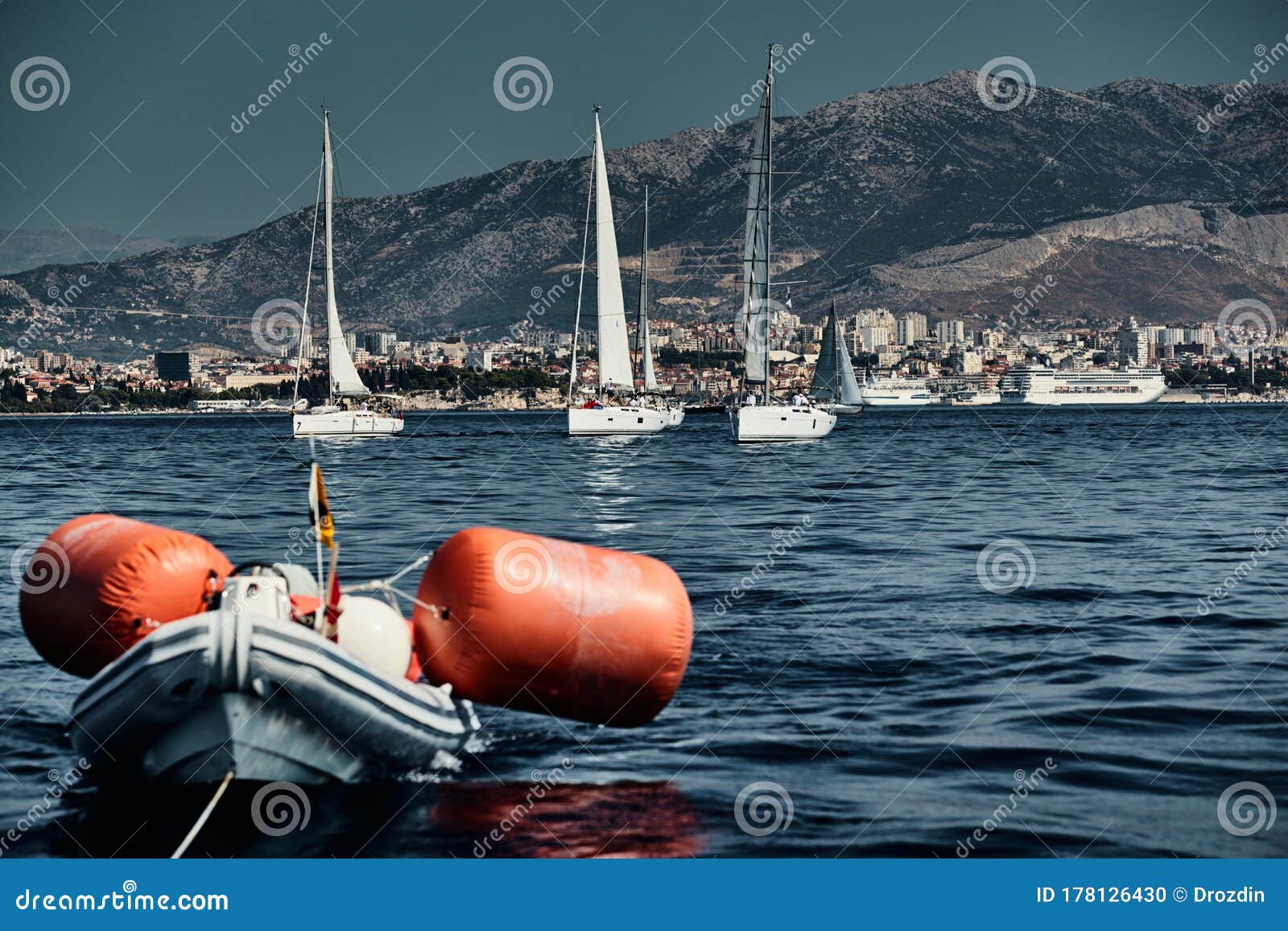 The Rubber Boat of Organizers of a Regatta with the Judge and