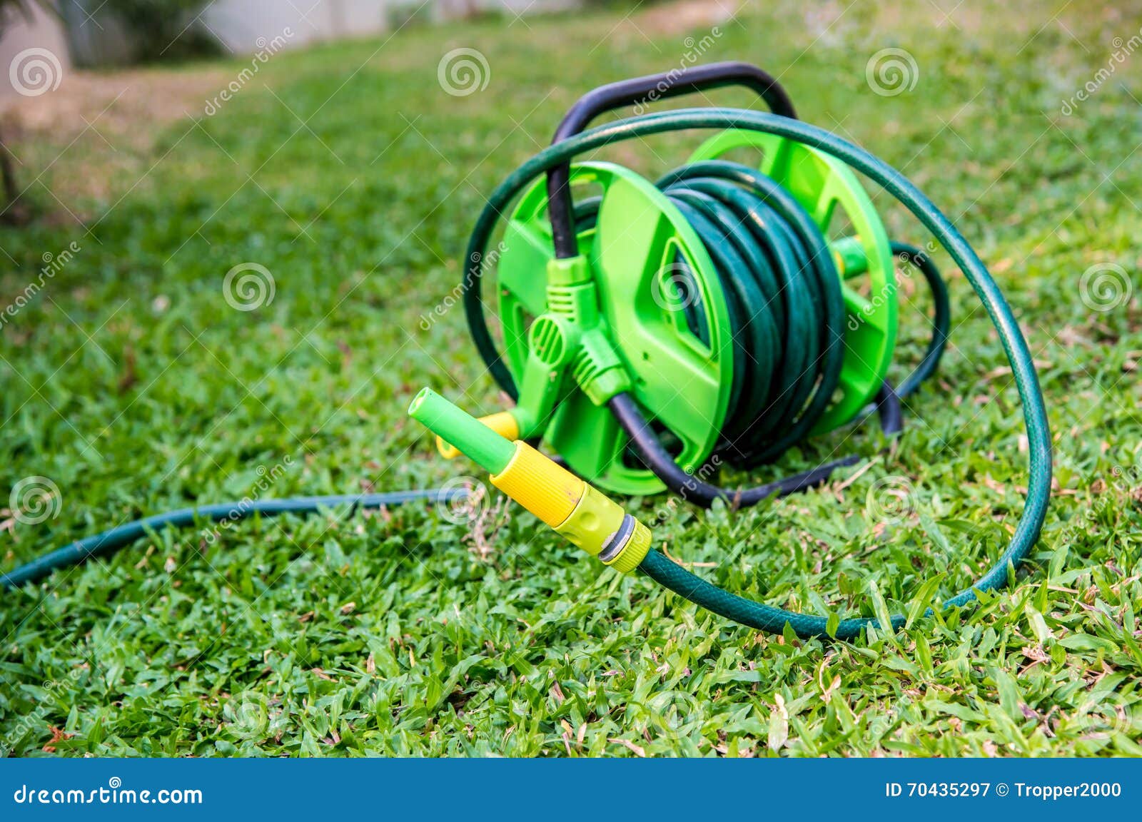 Rubber tube in the garden. stock image. Image of coil 70435297