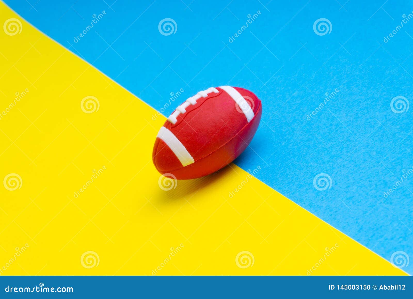 Rugby Ball on Blue and Yellow Background. Stock Illustration