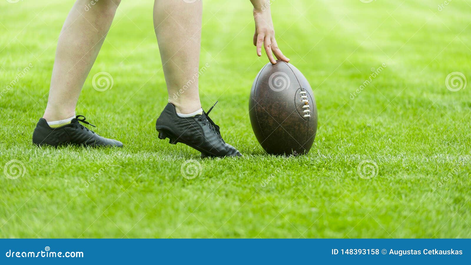 Rugby Ball with His Feet on the Grass Field Stock Photo Image of feet