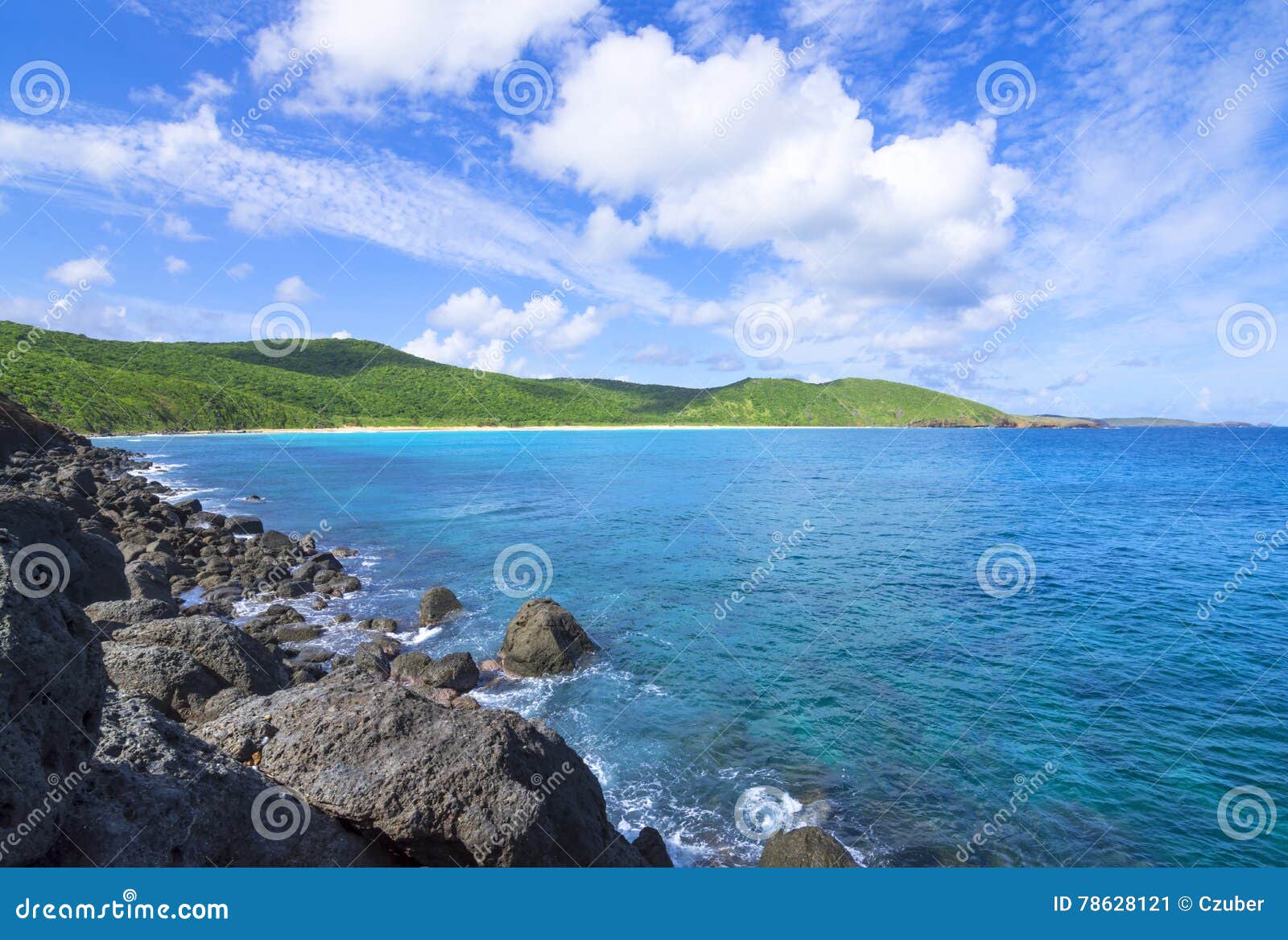 rugged caribbean coastline and rolling green hills