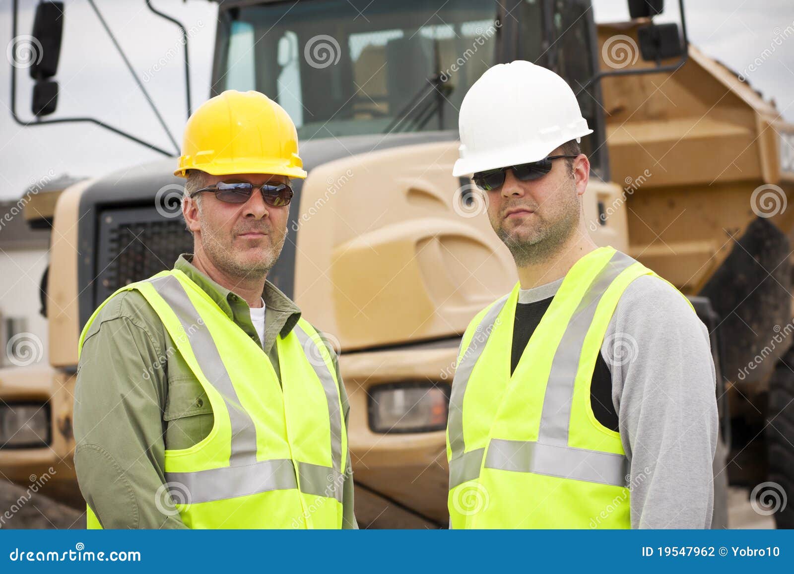 rugged male construction workers on the job