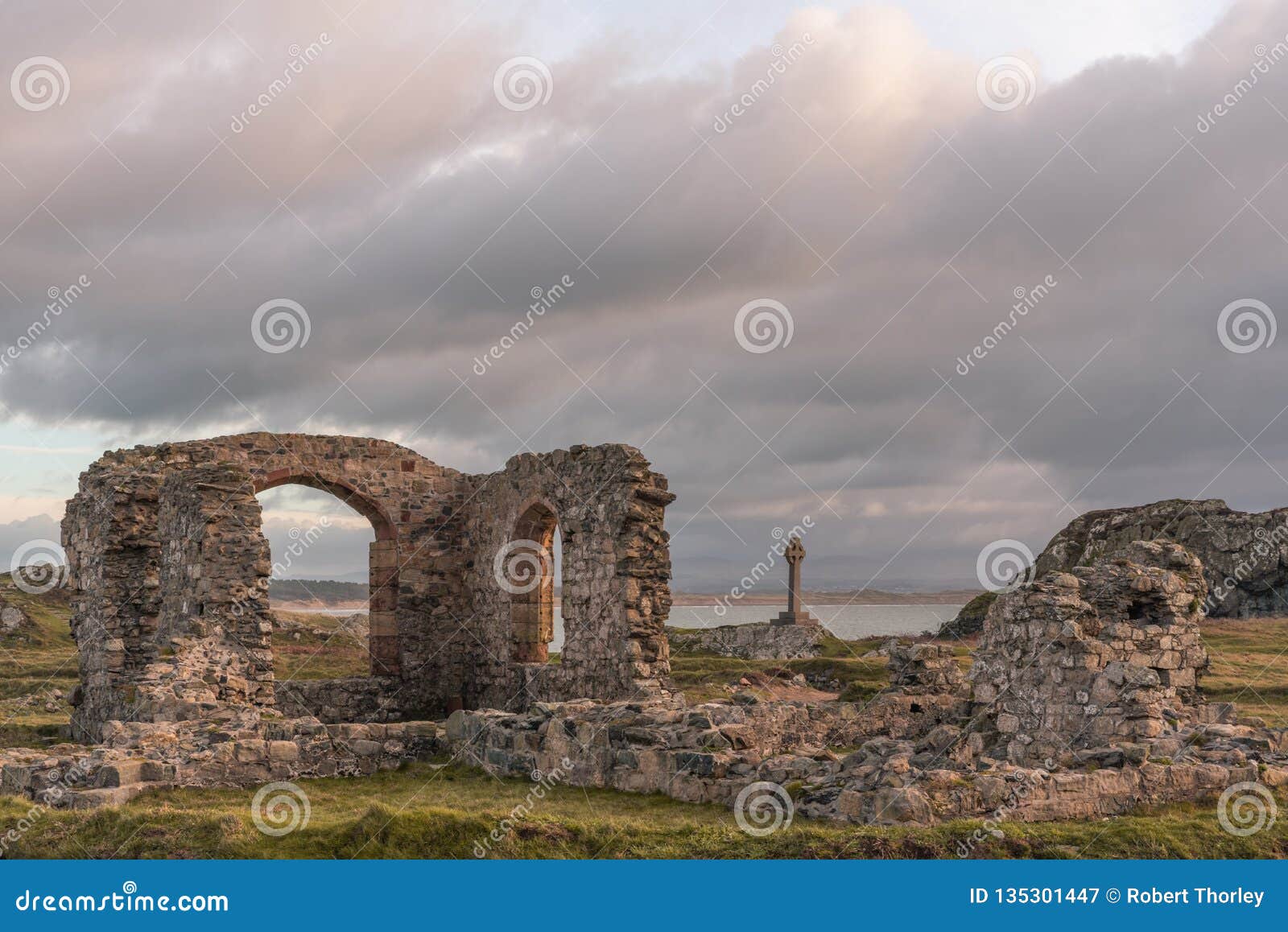 the ruined church and saxon cross at ynys llanddwyn on anglesey, north wales