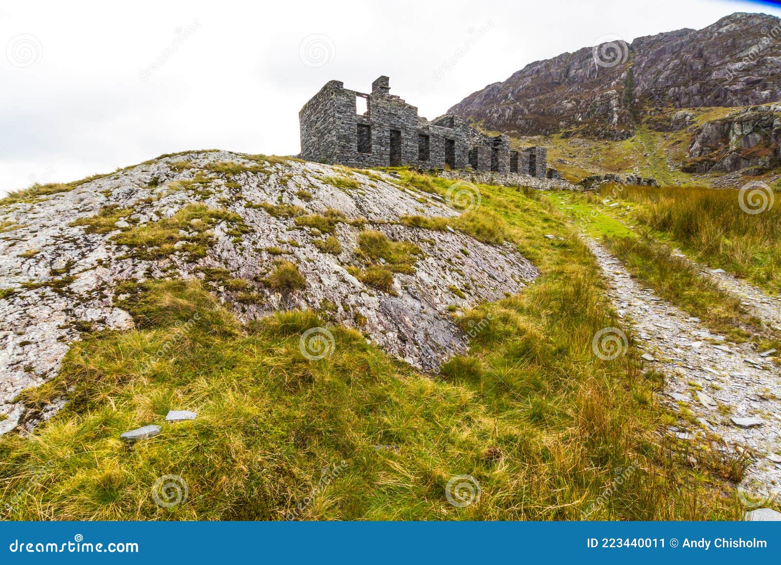ruined terrace of slate buildings, wise angle