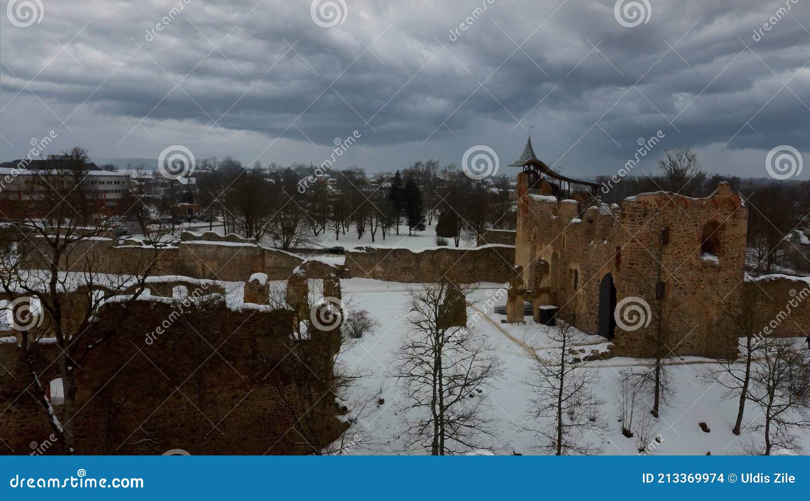 ruins of ancient livonian order`s stone medieval castle latvia aerial drone top shot from above
