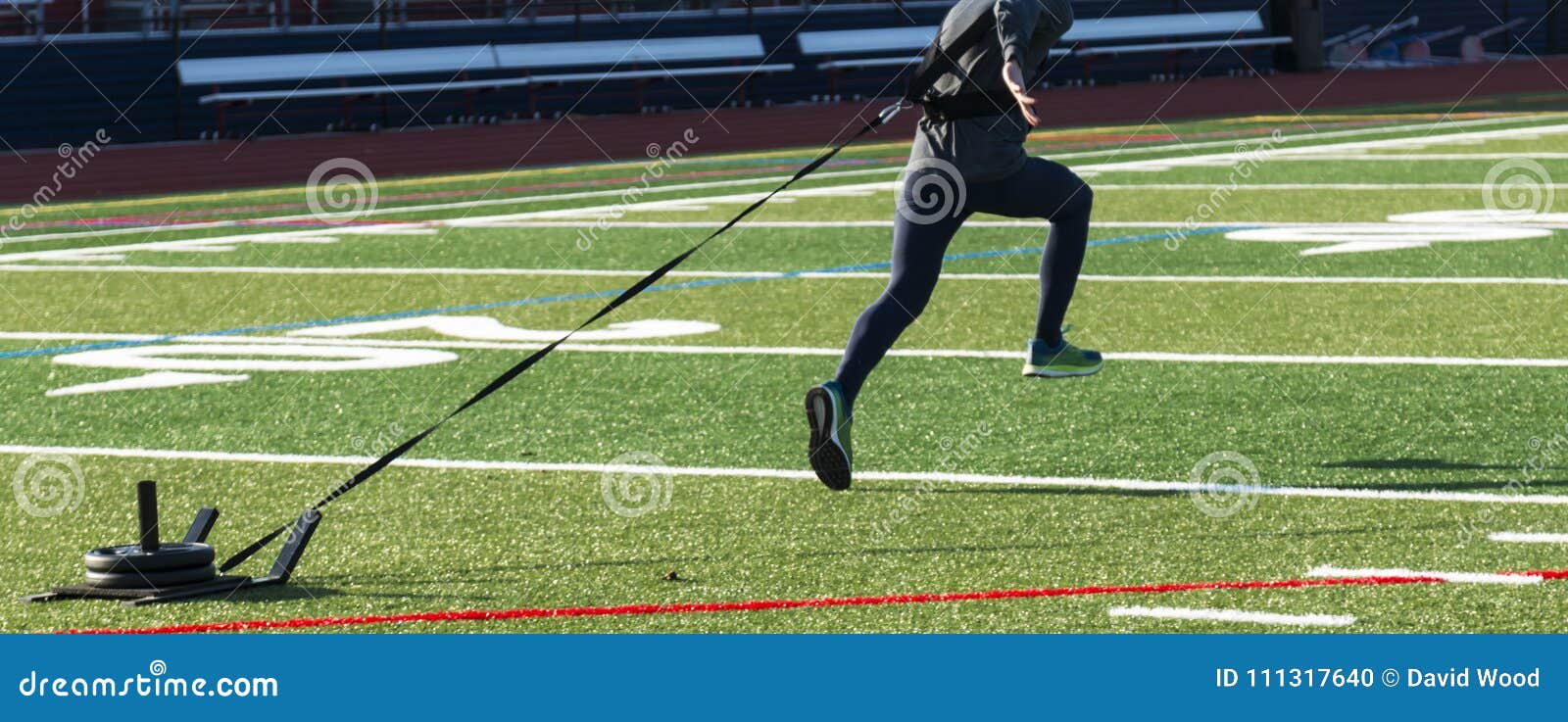 Runner Sprinting Pulling a Weght Sled Stock Photo Image of football