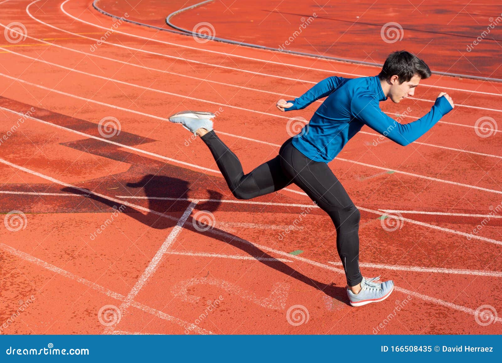 Runner Starting His Sprint on Running Track in a Stadium. Stock Image ...