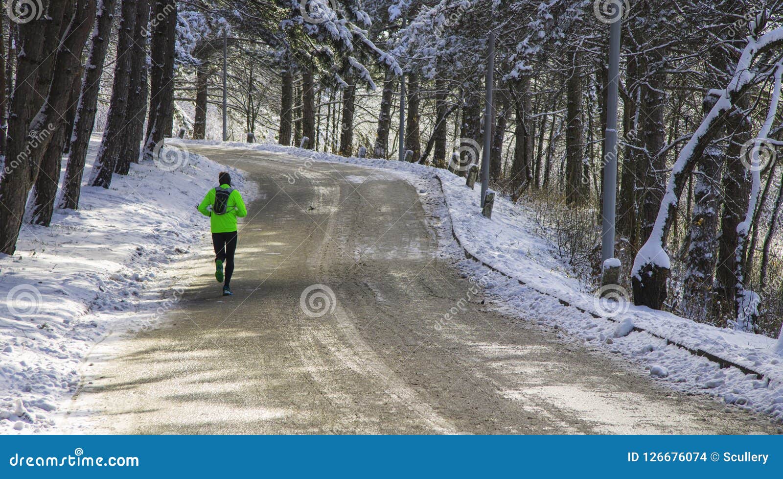 Runner Training in the Winter Forest at Sunday Morning Stock Photo ...