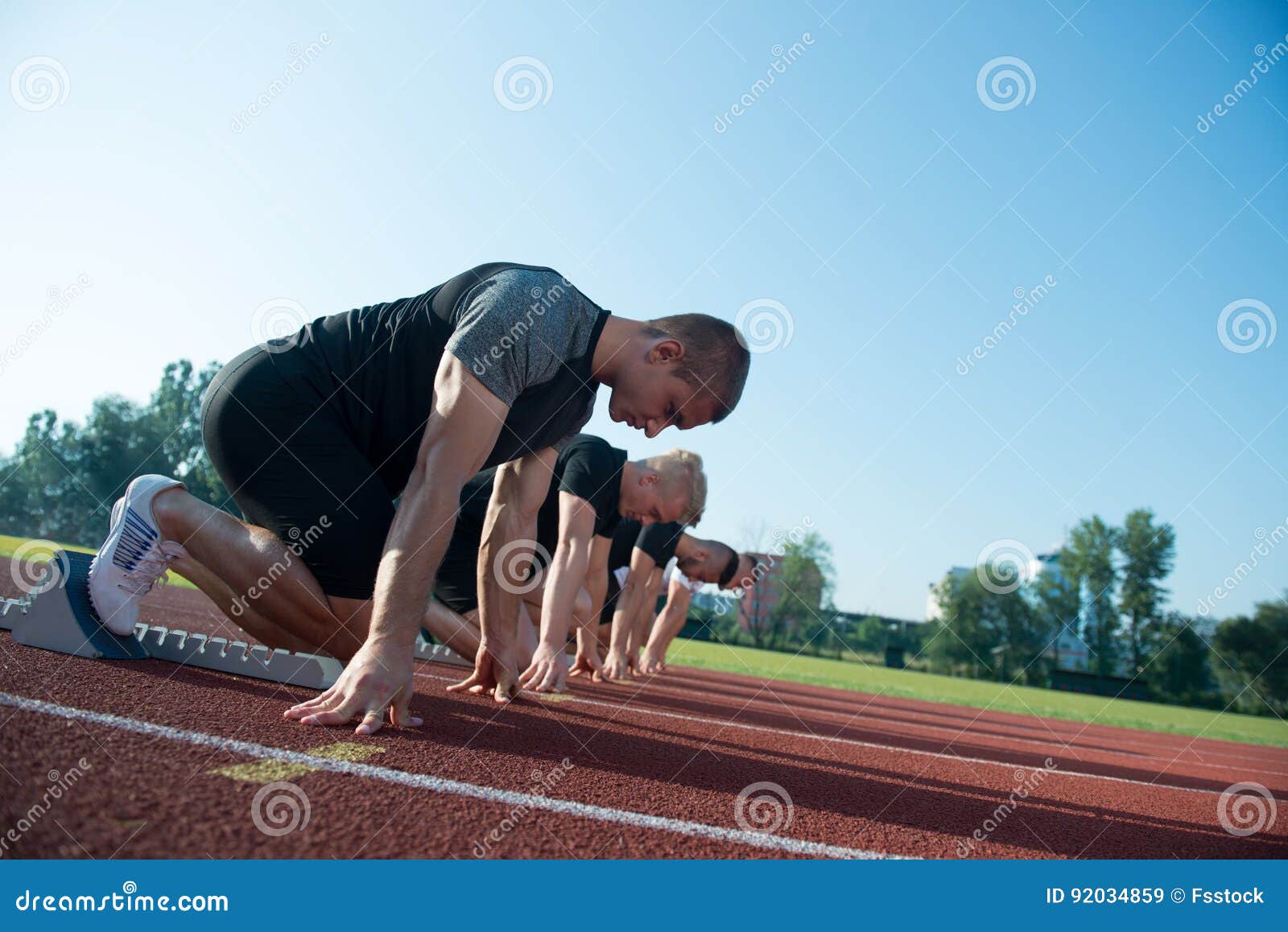 Runners Preparing for Race at Starting Blocks Stock Image Image of