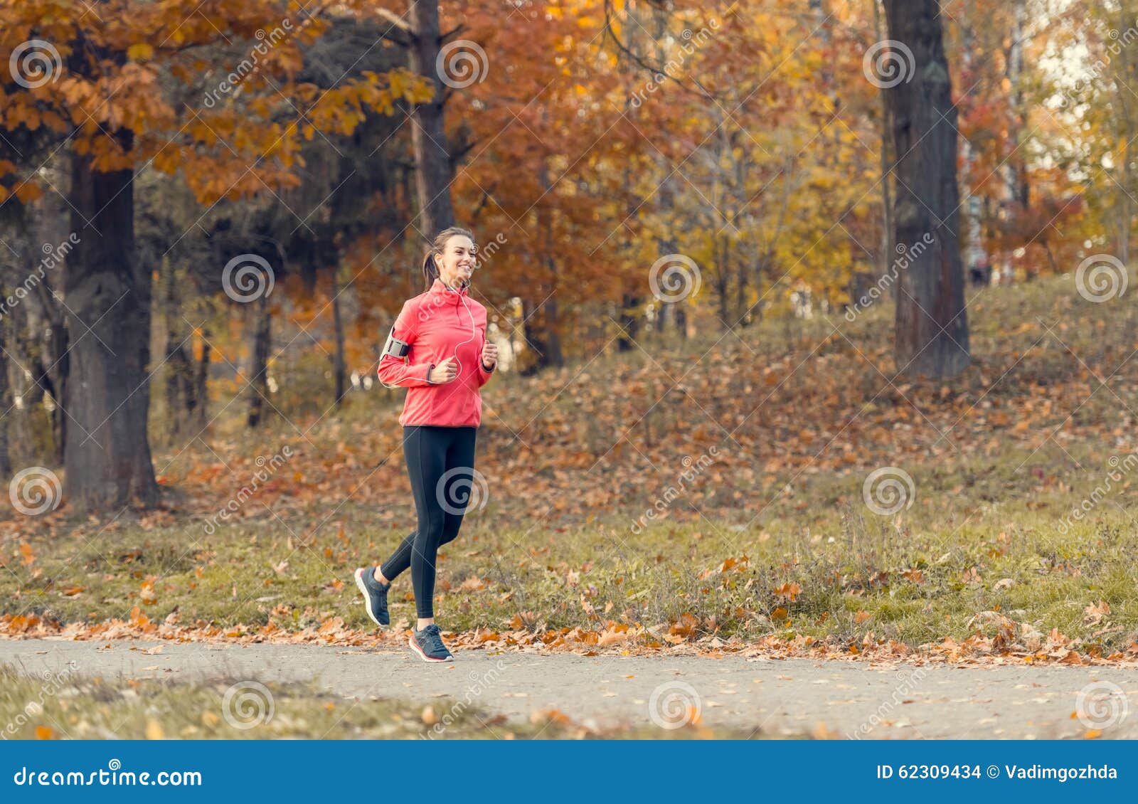 Running in the autumn park stock photo. Image of happy - 62309434