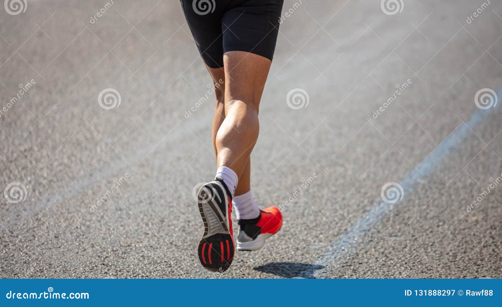 Running in the City Roads. Young Man Runner, Back View, Blur Background ...