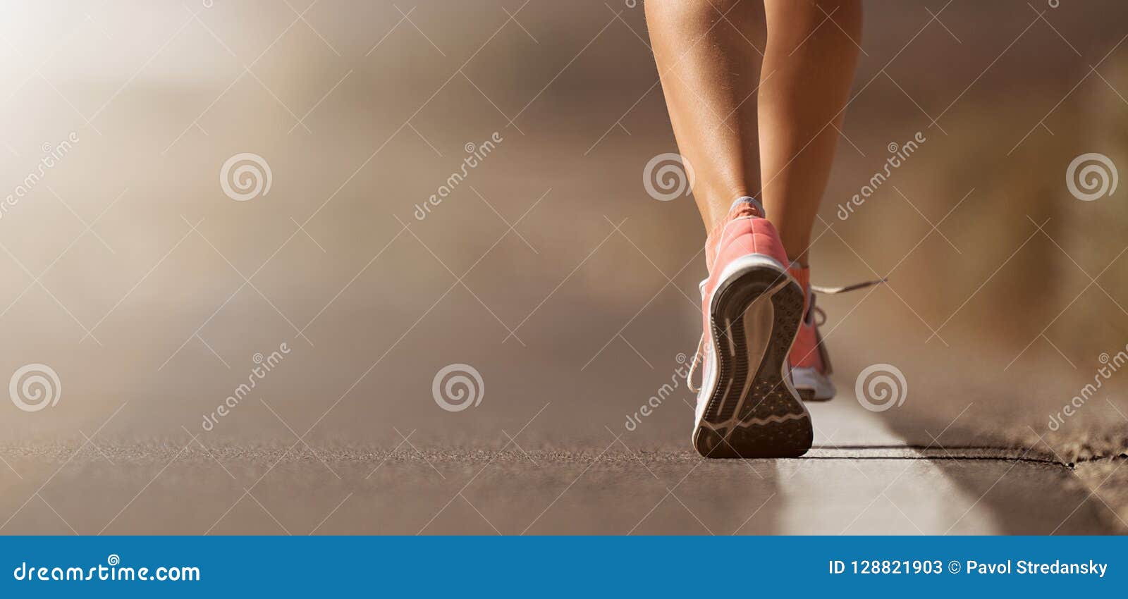 running shoe closeup of woman running on road