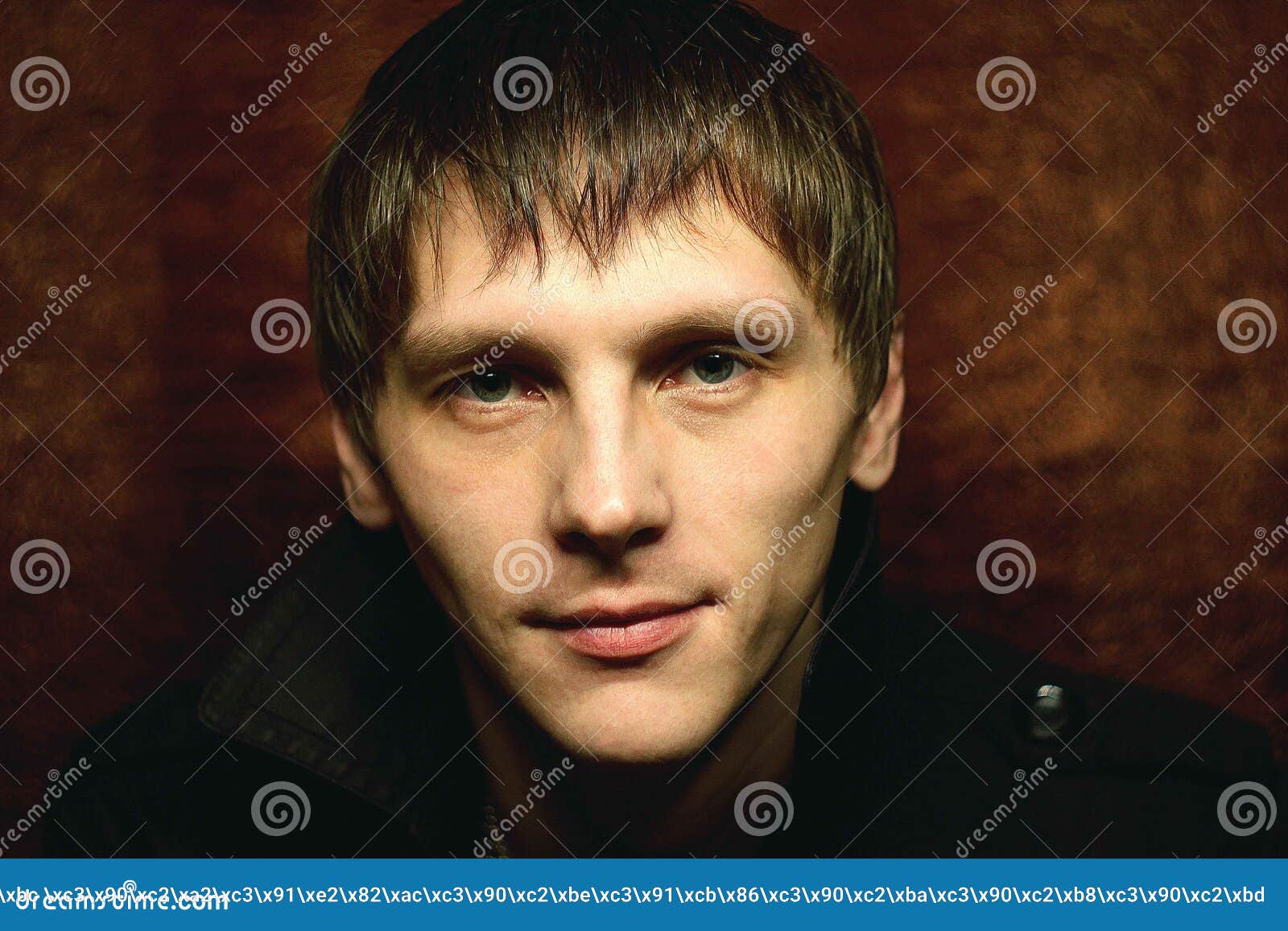 Russian Guy Posing on the Background of Red Cloth. Look, Face, Courage