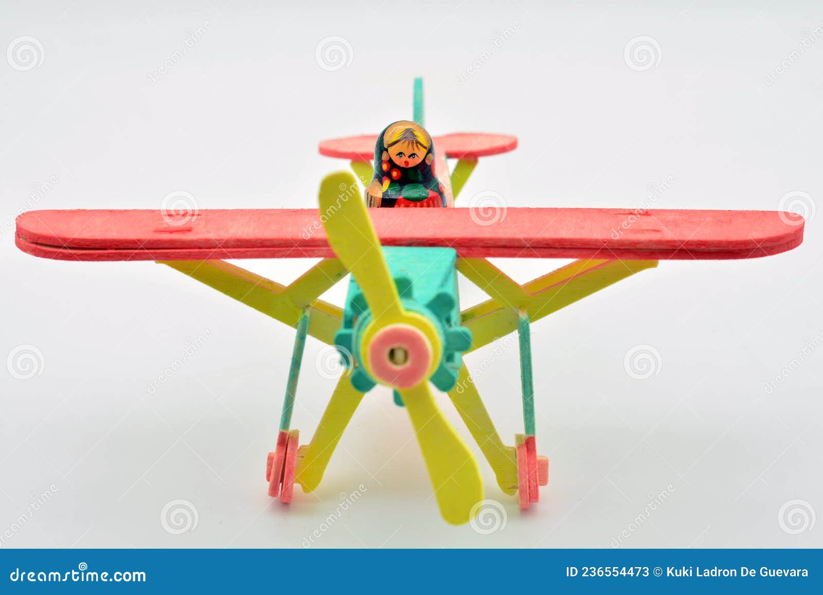 matryoshka doll mounted on a toy plane