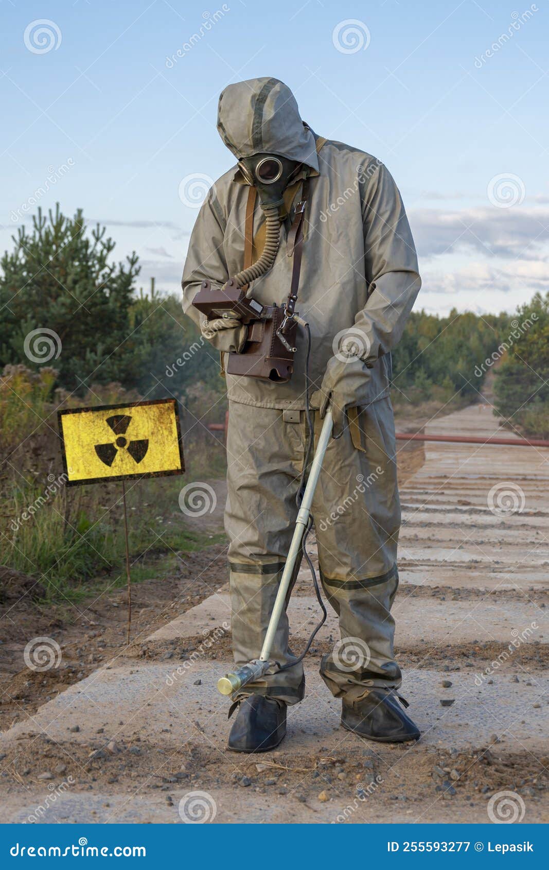 A Russian Military Man in a Chemical Protection Suit Measures the Radiation  Level on a Concrete Road with a Dosimeter. Concept: Co Stock Image - Image  of analyzing, nuclear: 255593277