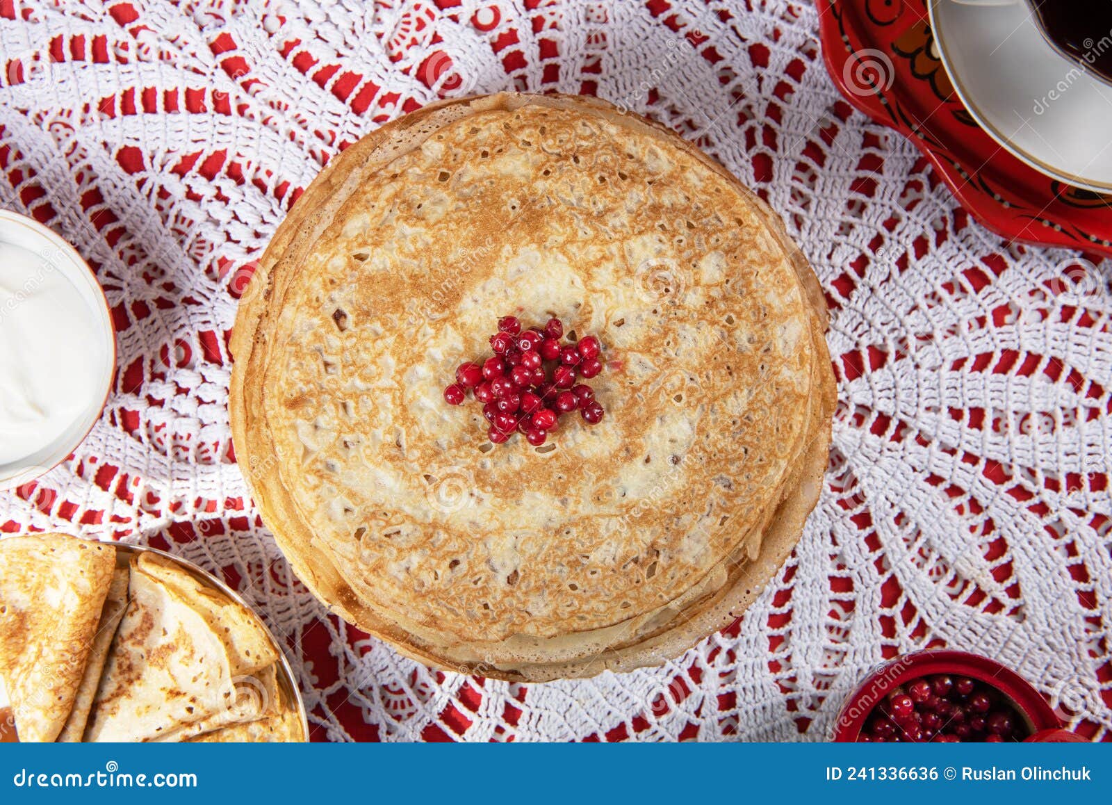 russian pancake blini with berries and sour cream