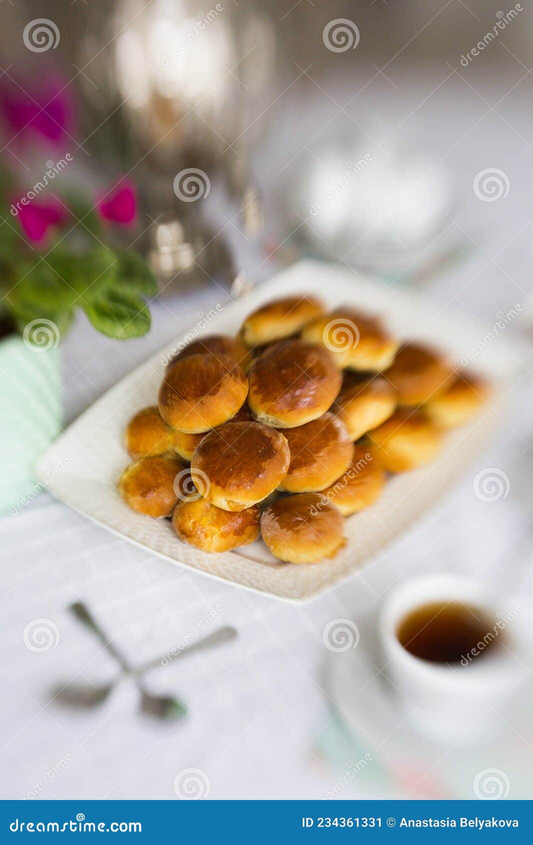 russian traditional teaparty with samovar and pies or pirozhki with apple jam