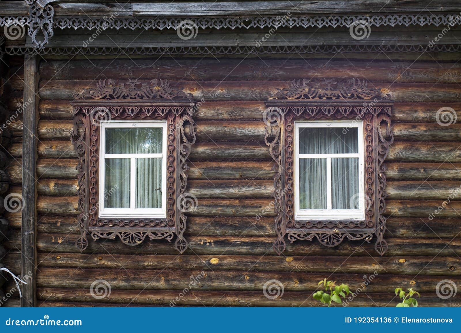 russian windows with carved frames and shutters in village houses